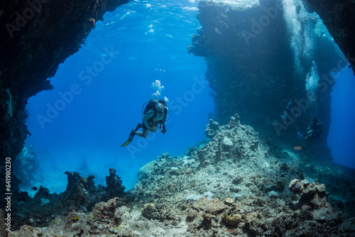 Fotografie, Obraz Diver explores St John's Caves in the southern Red Sea, Egypt