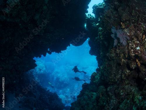 Divers explore St John's Caves in the southern Red Sea, Egypt