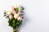 Bunch of pink and white rose flowers with copy space on white background