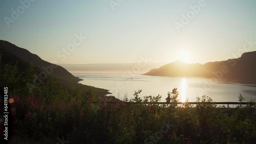 Vibrant Sunlight Over Mountains And Lake Over Flakstad Village In Senja Island, Northern Norway. Static Shot photo