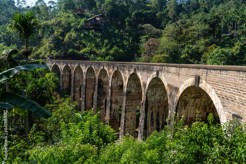 Train on the Nine Arches Demodara Bridge or the Bridge in the sky. Nine Arches Bridge is located in Demodara near Ella city, Sri Lanka.