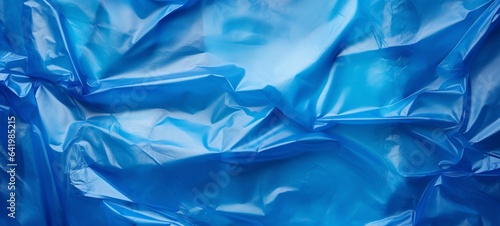 Closeup of crumbled blue garbage bag, trash bag texture - Plastic background photo