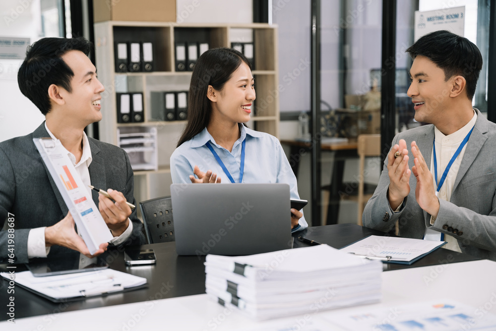 Asian business people working as a good team in the office. Successful teamwork in a meeting, workplace concept. Asian business people working as a good team in the office. Successful teamwork in a meeting, workplace concept.