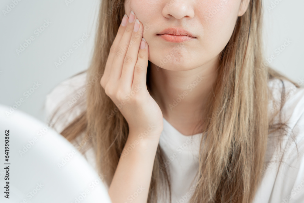 Young woman asian are worried about faces Dermatology and allergic to steroids in cosmetics. sensitive skin, red face from sunburn, acne, allergic to chemicals, rash on face. skin problems and beauty Young woman asian are worried about faces Dermatology and allergic to steroids in cosmetics. sensitive skin, red face from sunburn, acne, allergic to chemicals, rash on face. skin problems and beauty