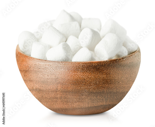 wooden plate with a bunch of marshmallows on a white isolated background