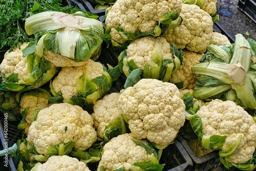 A mountain of cauliflower at a farmers' market.