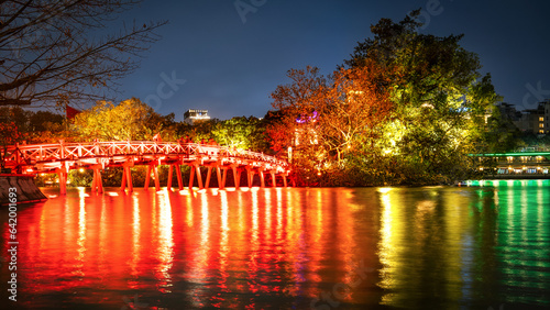 Hoan Kiem lake in Vietnam with temples and red bridge at night. Jade Mountain Temple and Turtle Island are points visited by tourists in Hanoi, Vietnam.
