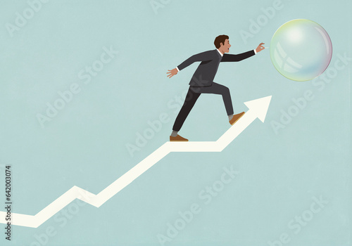 Businessman trying to pop bubble on ascending arrow
 photo