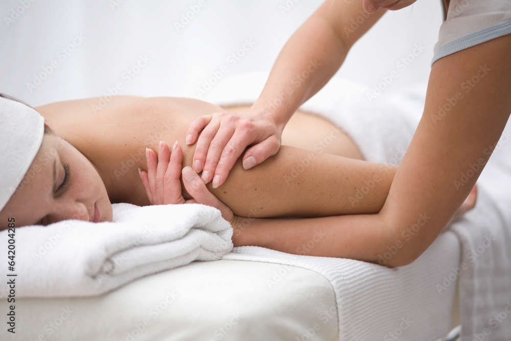 Woman receiving a back and shoulder massage
Woman receiving a back and shoulder massage