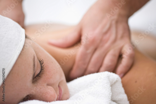 Woman receiving a back and shoulder massage
