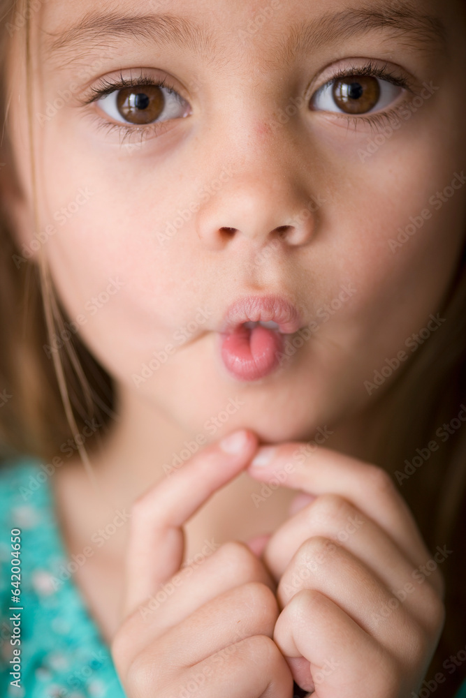 Close up of young girl pulling face
Close up of young girl pulling face