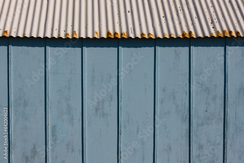 Extreme close up of light blue beach hut and blue sky
