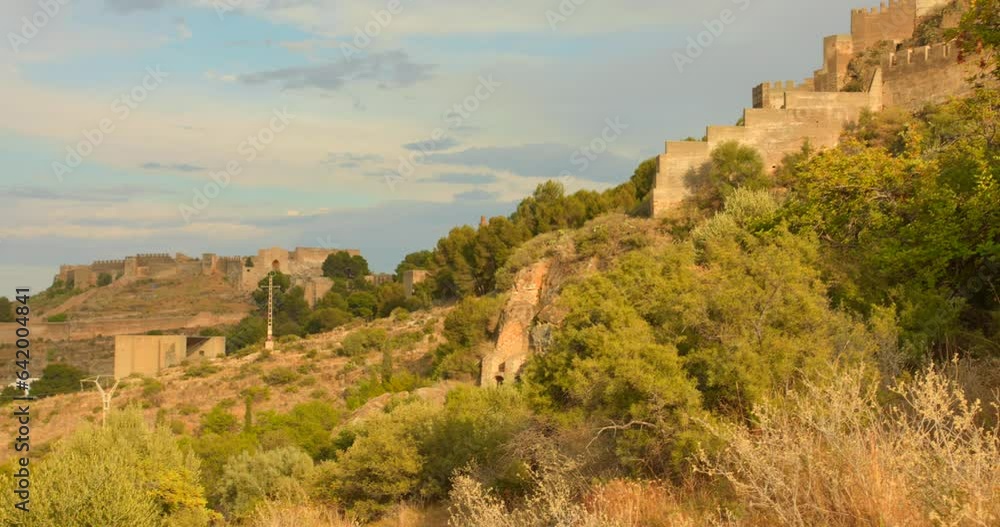 Town And Castle Ruin Over Mountain Landscape In Sagunto Near Valencia In Spain. Panning Right Town And Castle Ruin Over Mountain Landscape In Sagunto Near Valencia In Spain. Panning Right