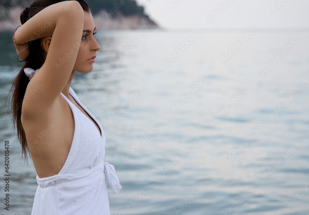 Portrait of young woman standing on beach
Portrait of young woman standing on beach