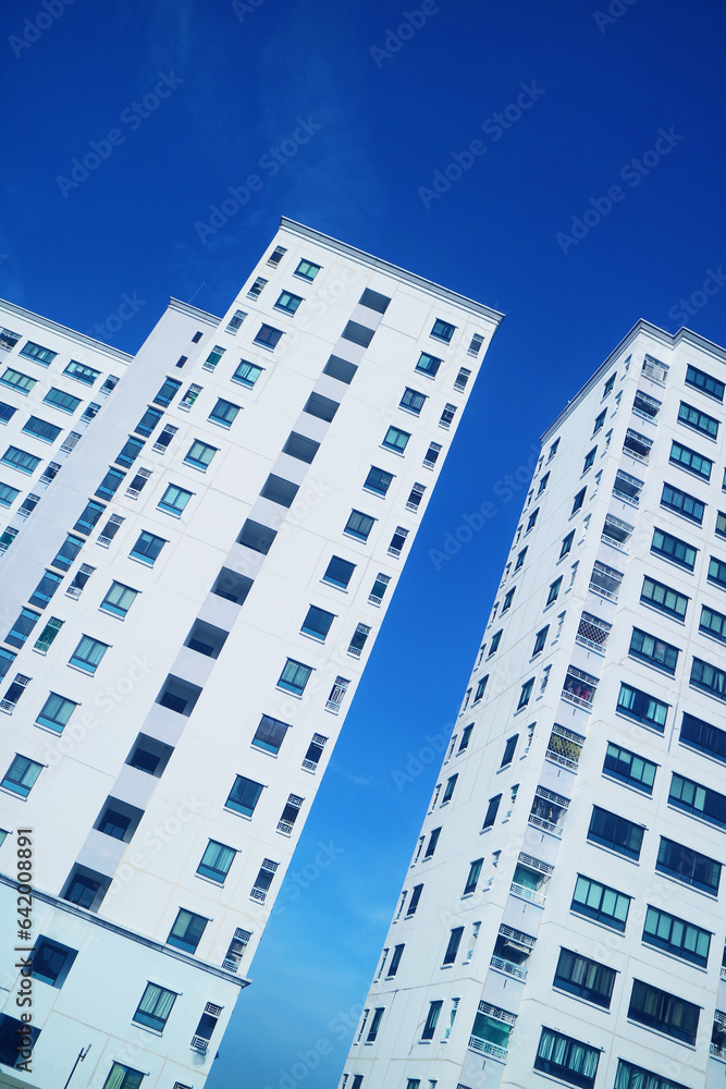 Low Angle View of Skyscrapers against Vivid Blue Sunny Sky