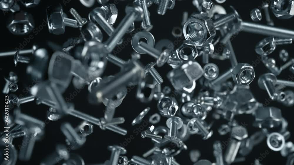 Super Slow Motion Shot of Fasteners Explosion Towards Camera Isolated on Black at 1000fps. Super Slow Motion Shot of Fasteners Explosion Towards Camera Isolated on Black at 1000fps.