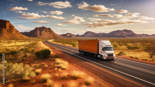 Huge semi-truck crossing the Australia northern territory bush landscape on an empty road