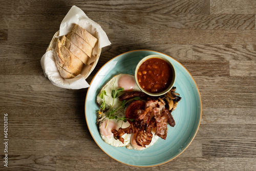 Wallpaper Mural English Breakfast with fried eggs, bacon, Hungarian sausage, mushrooms, baked beans and tomatoes Torontodigital.ca