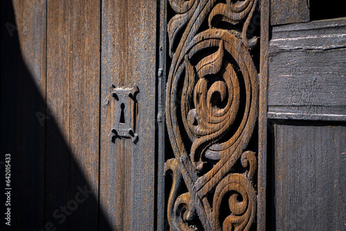 Ancient key hole. Details of Heddal Stave Church. 13th century wooden, the largest remaining stave church in Norway, Notodden, Telemark, Norway, Scandinavia. Sunny day, sharp shadows.  photo