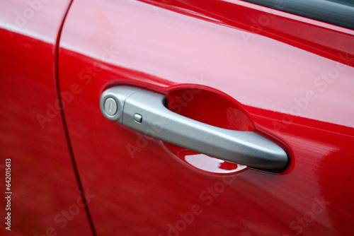 Stylish door handle on a modern red vehicle