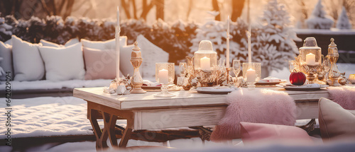 Cozy romantic composition with served dinner table,backyard  furniture, candles, lantern, garland. Evening winter patio. Christmas, New Years holidays. Outdoors vacation. Exterior Design.Generative ai © Inai