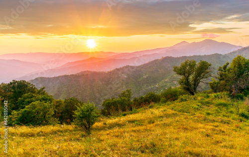 summer scenery mountain view from a highland hill to a beautiful sunset.