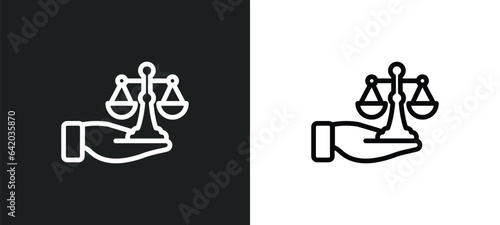 justice scales in hand icon isolated in white and black colors. justice scales in hand outline vector icon from law and justice collection for web, mobile apps and ui.