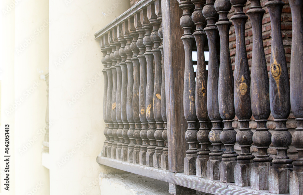 Traditional old wooden railings decorative pattern at old stone house in Geotgia
