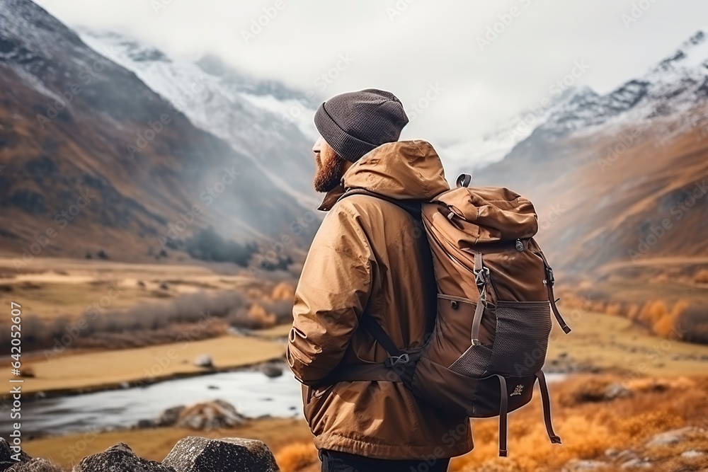 tourist hiker in warm clothes and a backpack tourist hiker in warm clothes and a backpack