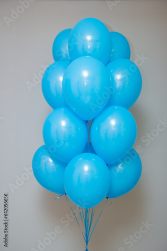 bundle of blue latex balloons isolated on white background
