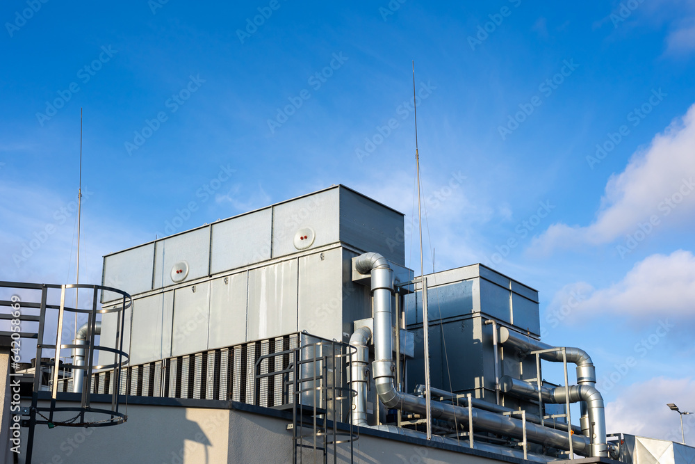 Central unit of the ventilation and air conditioning system on the roof of the building. The photo was taken in natural, soft light. View from above.