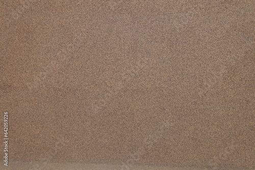 wall with coarse brown and black pebbledash finish texture photo