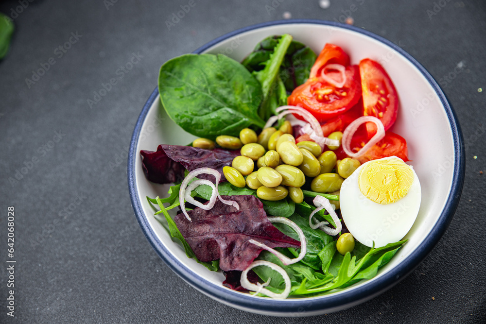 edamame bean salad vegetables, tomato, boiled egg, salad dressing ready to eat healthy appetizer meal food snack on the table copy space food background edamame bean salad vegetables, tomato, boiled egg, salad dressing ready to eat healthy appetizer meal food snack on the table copy space food background