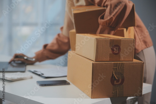 Starting small businesses SME owners female entrepreneurs Write the address on receipt box and check online orders to prepare to pack the boxes, sell to customers, sme business ideas online.