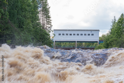 idle discharge of water at a small hydroelectric power station photo