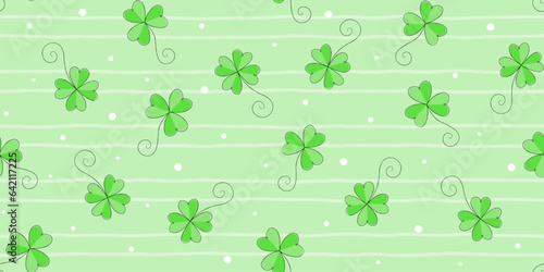 Green shamrocks and clover leaves with black edging on a pale green striped background with dots. St. Patrick s Day endless texture. Vector seamless pattern for festive wrapping paper  cover and print