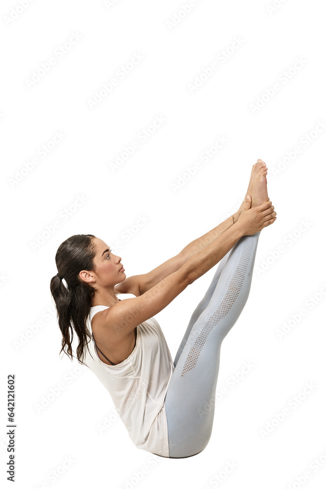 young woman practicing yoga, Navasana the boat pose young woman practicing yoga, Navasana the boat pose