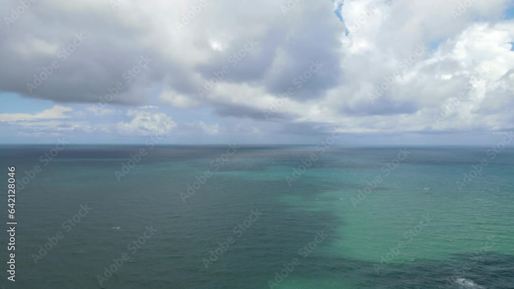 blue beach and clouds reflection on the sea surface, natural colors, blue background aerial view.insert text. blue beach and clouds reflection on the sea surface, natural colors, blue background aerial view.insert text.