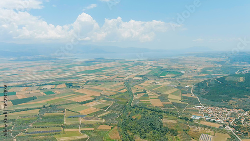 Lamia, Phthiotis, Greece. Panorama of the valley with fields. Olive trees, colorful fields. Summer, Cloudy weather, Aerial View