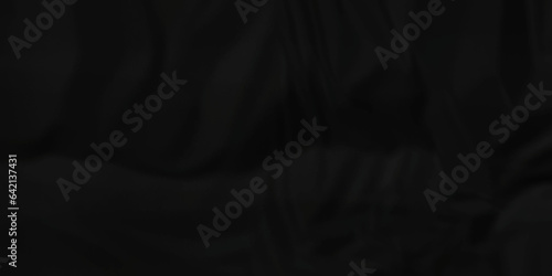 	
Dark crumple black paper wrinkled poster template ,blank glued creased paper texture background. black paper crumled backdrop background. used for cardboard and clarkboard.