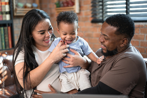 Fotografía Happy African American baby son with family at home