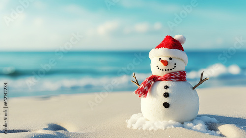 Snowman in a Santa Claus hat on a sandy white beach on the Caribbean Sea. Celebration of the New Year in warm countries. Travel.