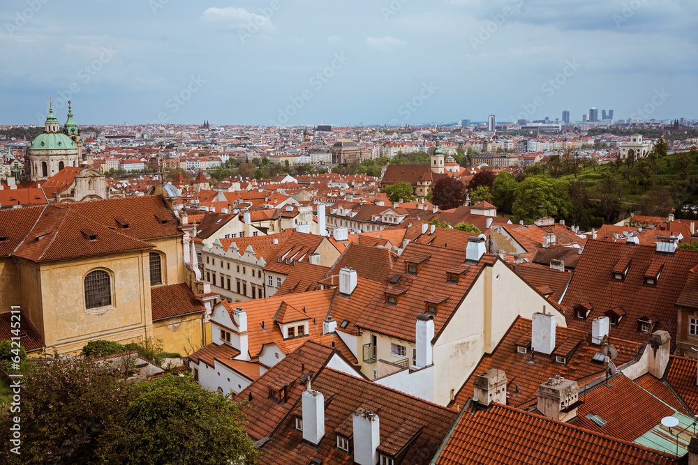 Top view to red roofs skyline of Prague city, Czech Republic. Aerial view of Prague city with terracotta roof tiles, Prague, Czechia. Old Town architecture with terracotta roofs in Prague