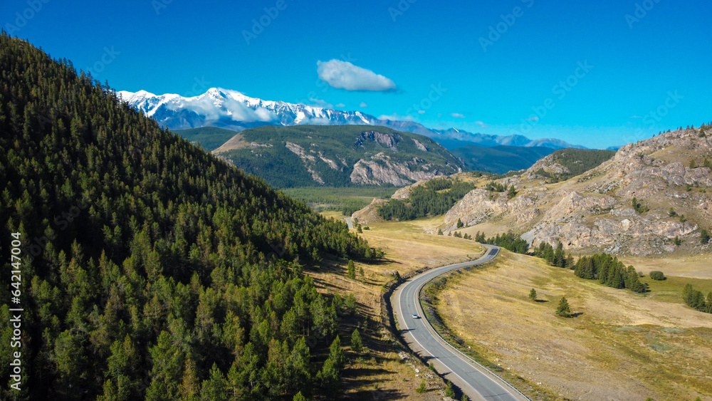 Aerial view of mountain road. Active tourists place in Altai region, Chui tract. Asphalt road in mountains.