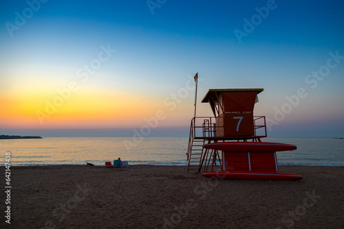 The beach with a Lifeguard Station on Sunrise Located on May 2, Romania photo