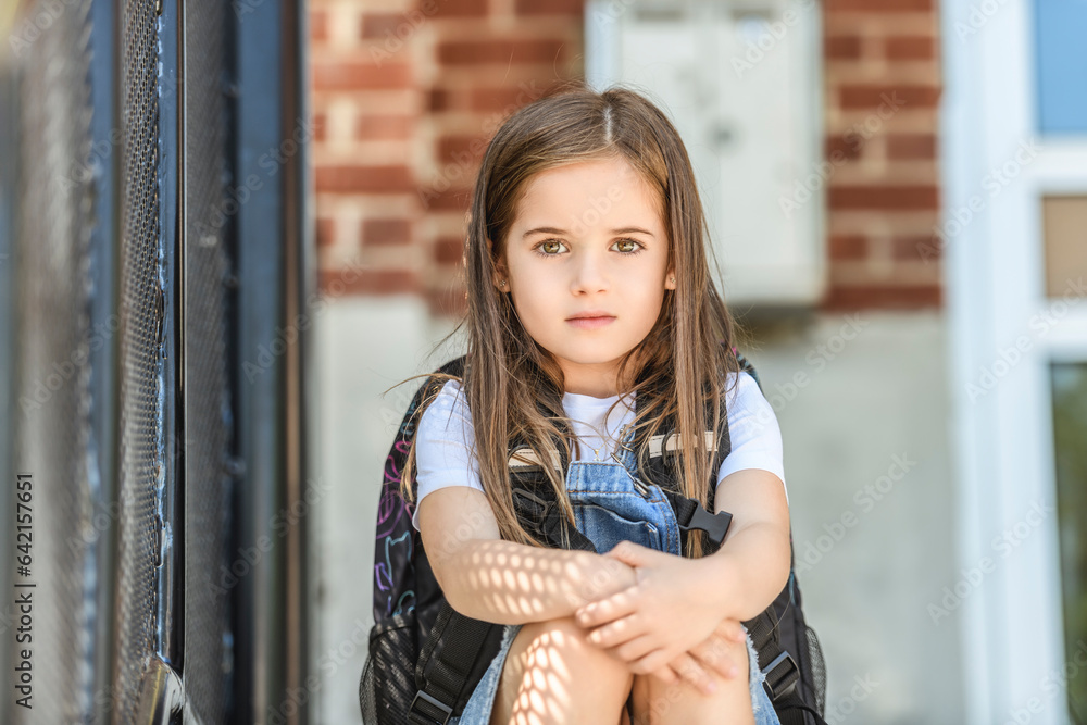 Fototapeta premium student girl wearing school backpack outside of the school