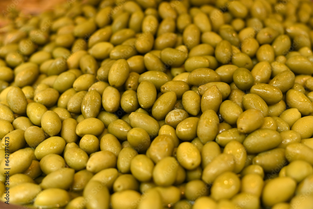 Green ripe olives close-up. Background of olives Green ripe olives close-up. Background of olives