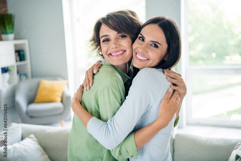 Photo of two pretty idyllic cute people beaming smile cuddle free time peaceful weekend apartment inside Photo of two pretty idyllic cute people beaming smile cuddle free time peaceful weekend apartment inside