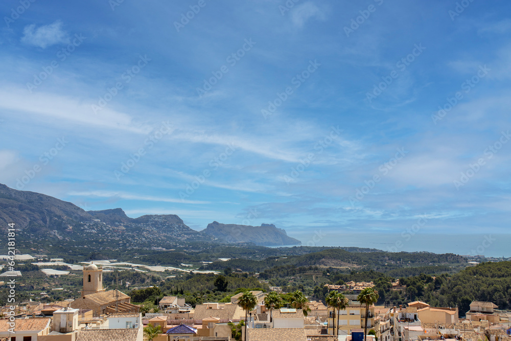 panoramic view of spanish mediterranean village, with sea and mountain views.