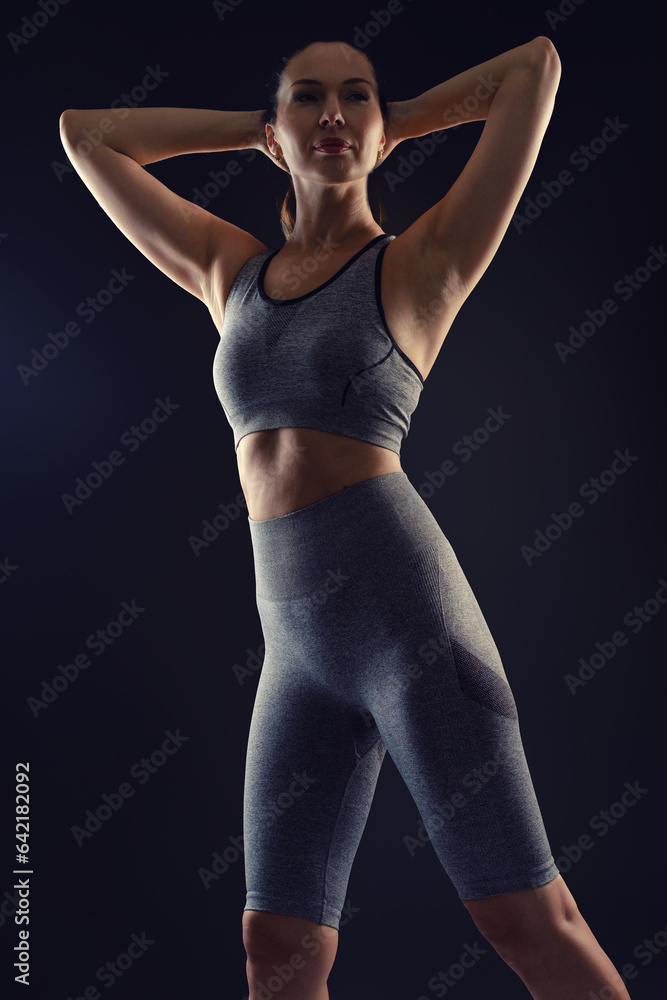 Obraz premium Sport woman on black background.